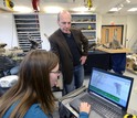 scientist with student preparing 3-D scans